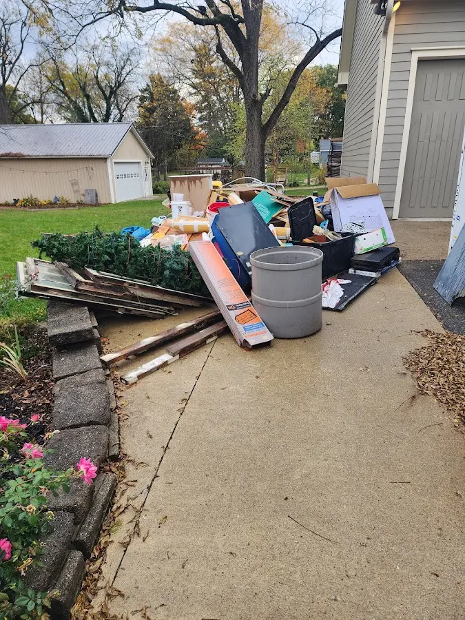 Dumpster being loaded with debris for 3 Yard Dumpster Rental in Eastham